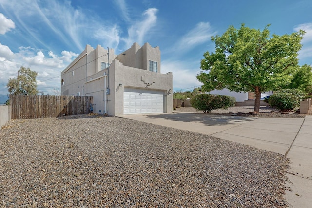 view of side of home with a garage