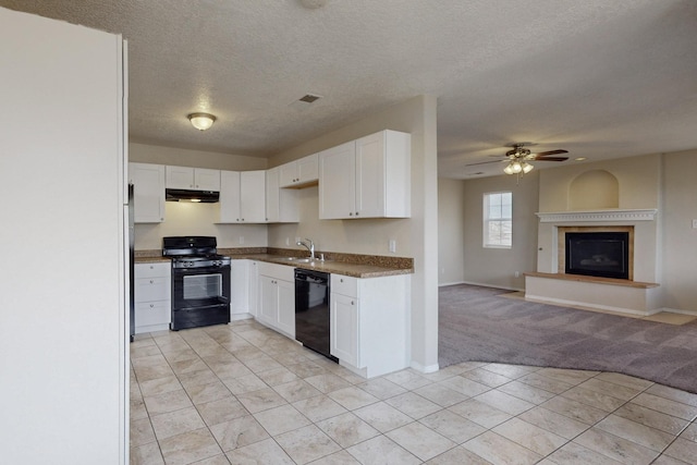 kitchen with black appliances, sink, ceiling fan, a textured ceiling, and white cabinetry