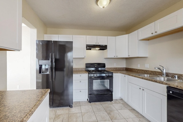 kitchen featuring a textured ceiling, sink, black appliances, white cabinetry, and light tile patterned flooring