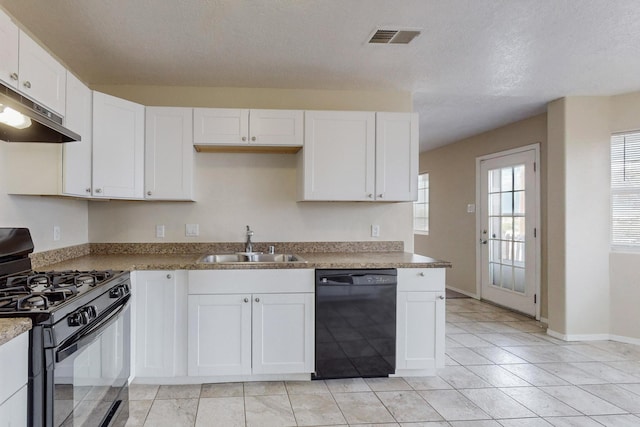 kitchen featuring light stone countertops, sink, a textured ceiling, white cabinets, and black appliances