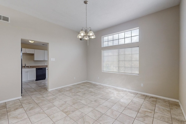 empty room with sink and an inviting chandelier