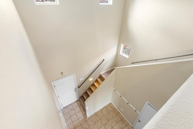 staircase with tile patterned flooring