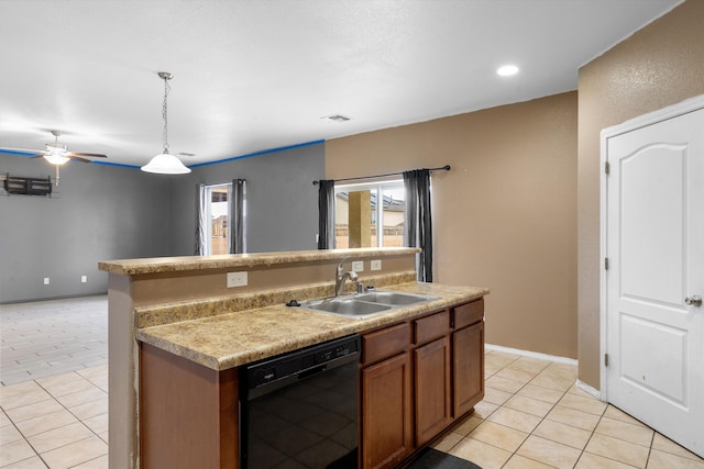 kitchen with black dishwasher, sink, hanging light fixtures, light tile patterned floors, and a center island with sink