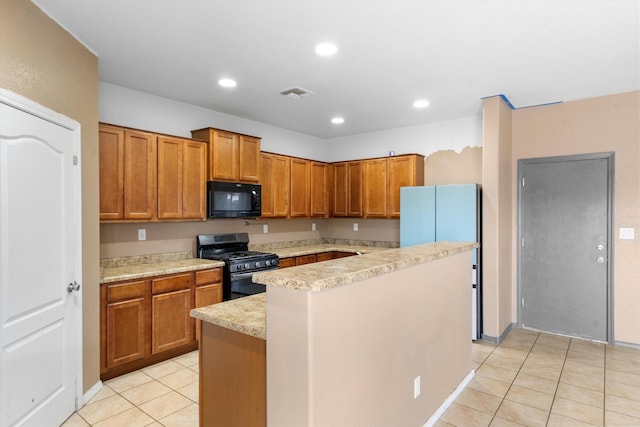 kitchen with black appliances, a kitchen island, and light tile patterned flooring