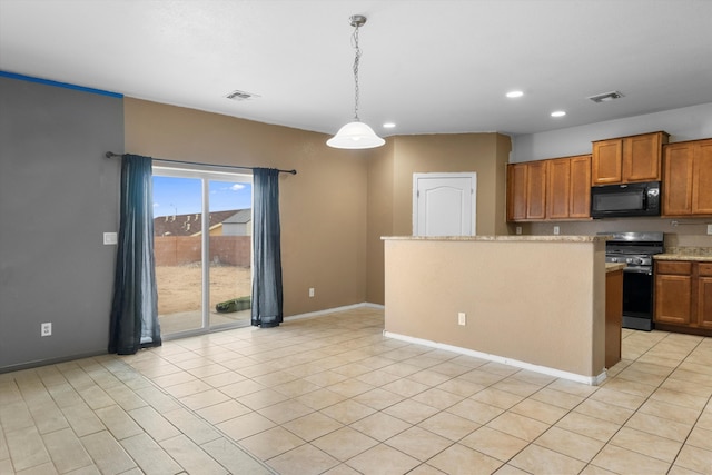 kitchen featuring decorative light fixtures and gas range