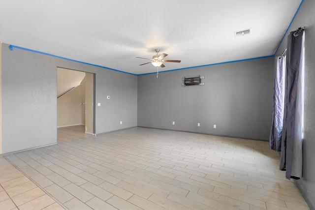 unfurnished room featuring ceiling fan