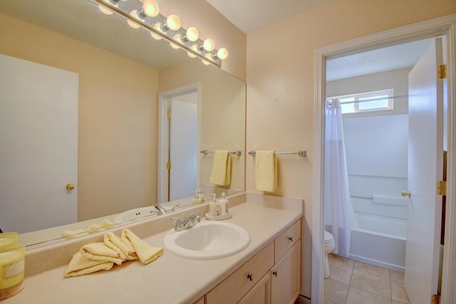 full bathroom with tile patterned flooring, shower / bath combo, vanity, and toilet