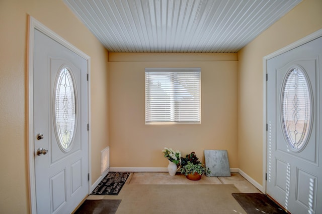 view of carpeted foyer