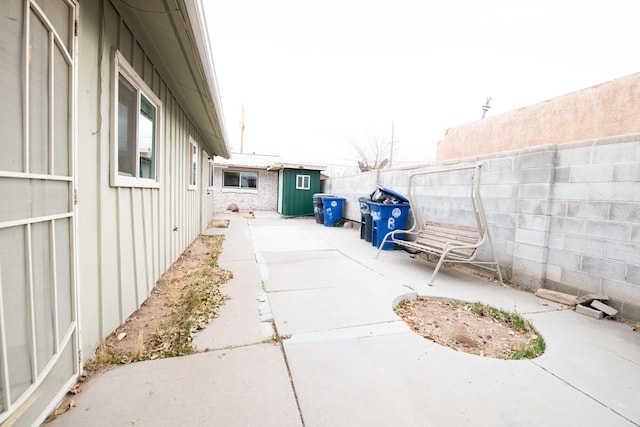 view of patio / terrace with a shed