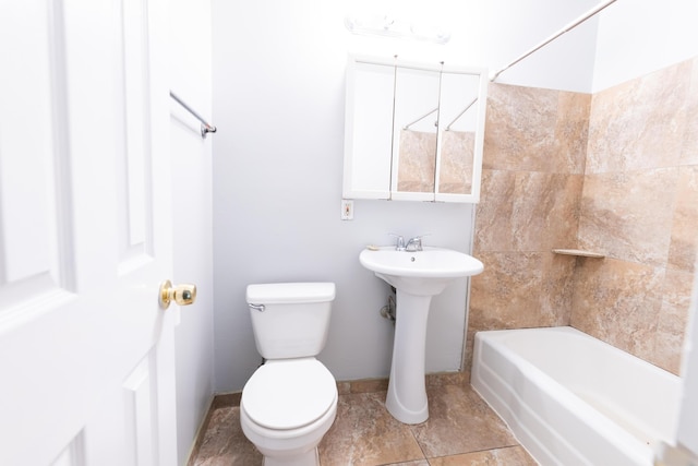 bathroom with shower / bathing tub combination and toilet