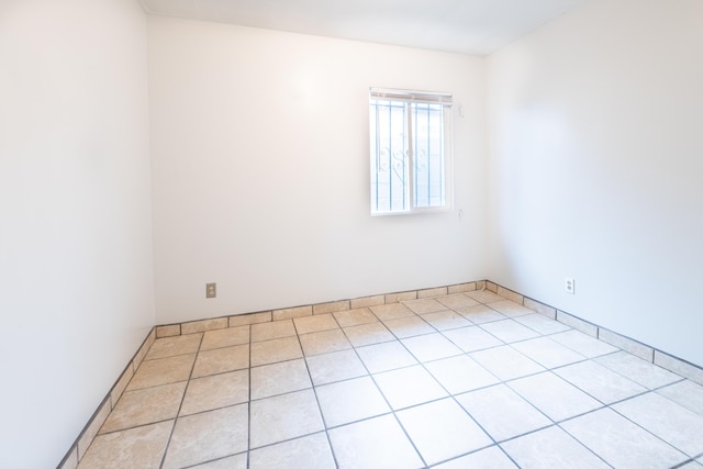 unfurnished room with light tile patterned floors