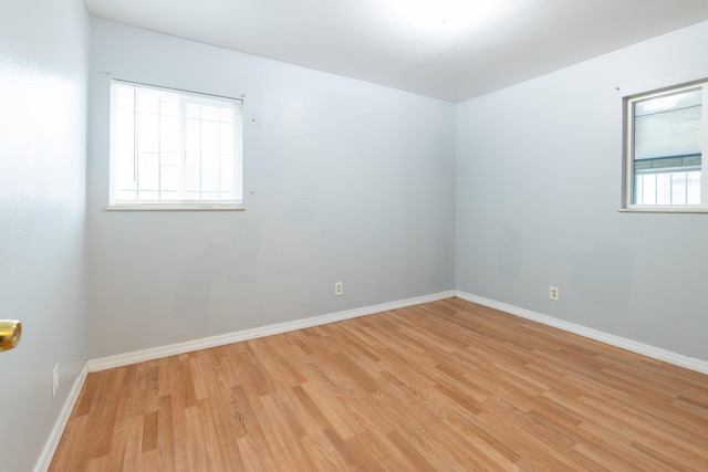 spare room with light hardwood / wood-style floors