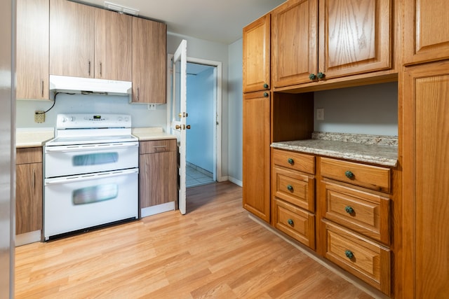 kitchen featuring stove and light hardwood / wood-style floors