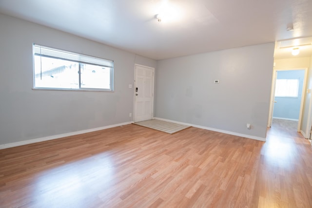 unfurnished room featuring light wood-type flooring