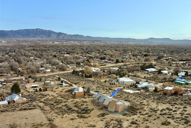 aerial view featuring a mountain view and view of desert