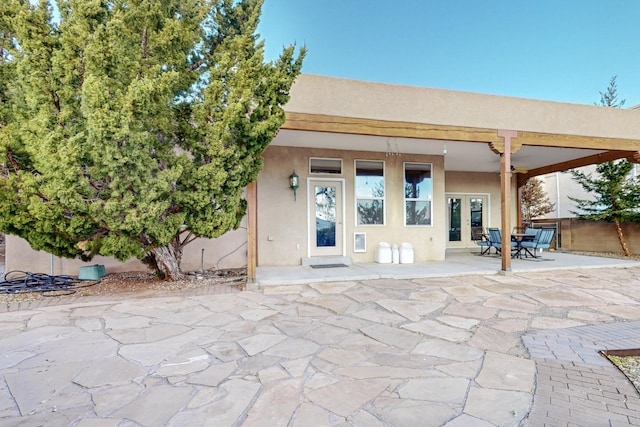 rear view of property featuring a patio area