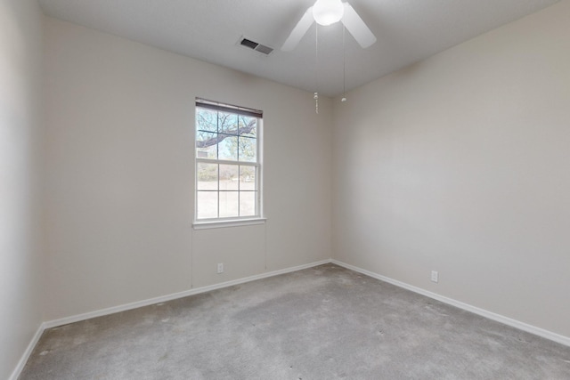 unfurnished room featuring light colored carpet and ceiling fan