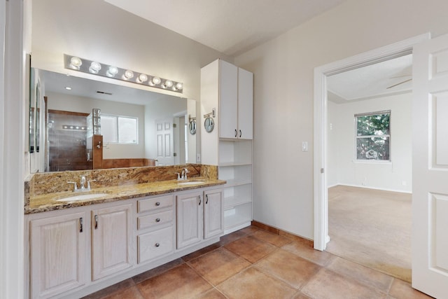 bathroom with vanity and ceiling fan