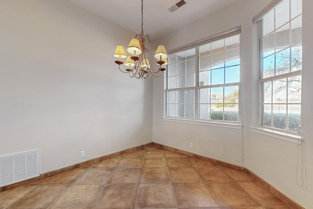 empty room with a chandelier