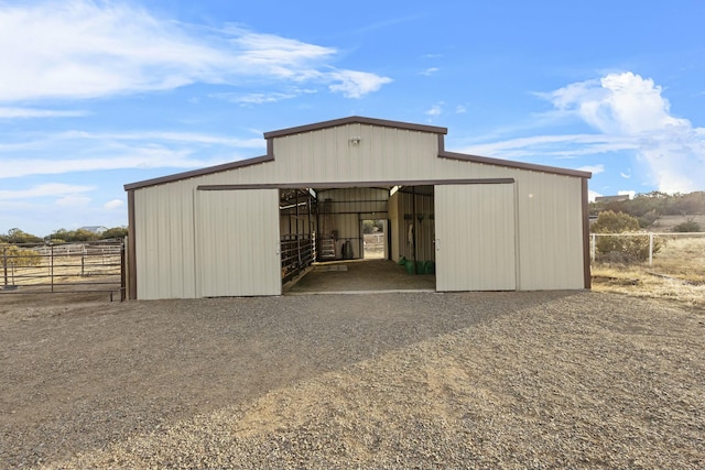 view of outbuilding featuring an outdoor structure and an exterior structure