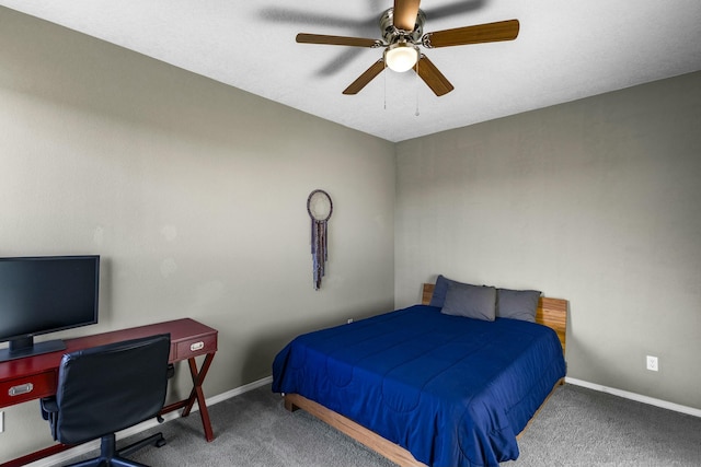 carpeted bedroom with baseboards and a ceiling fan