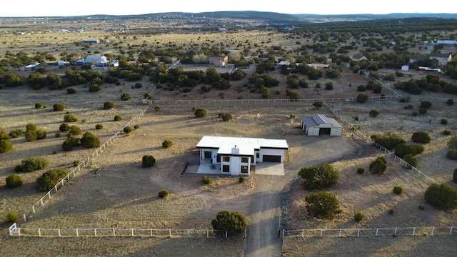 bird's eye view with a rural view and view of desert