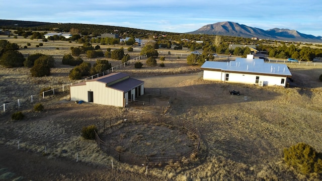 birds eye view of property with a mountain view