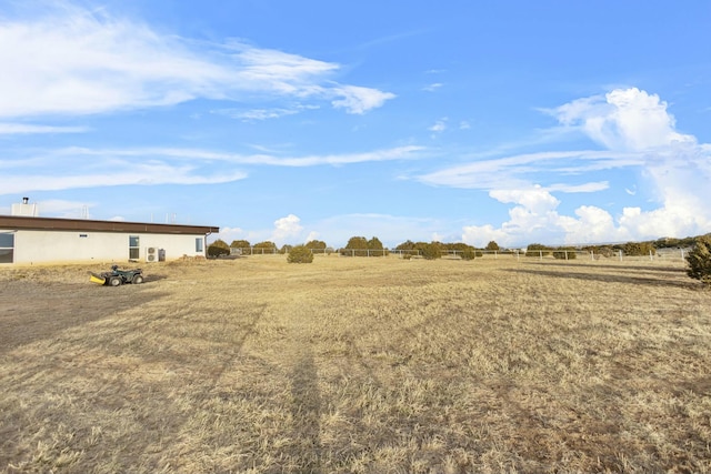 view of yard with a rural view