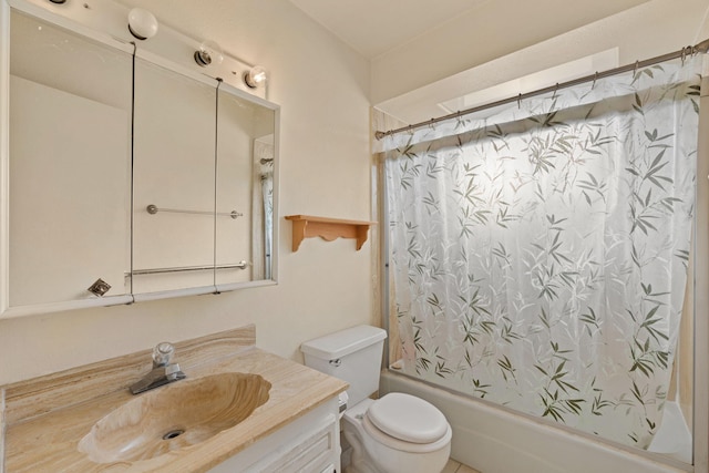 full bathroom featuring shower / bath combo with shower curtain, vanity, and toilet