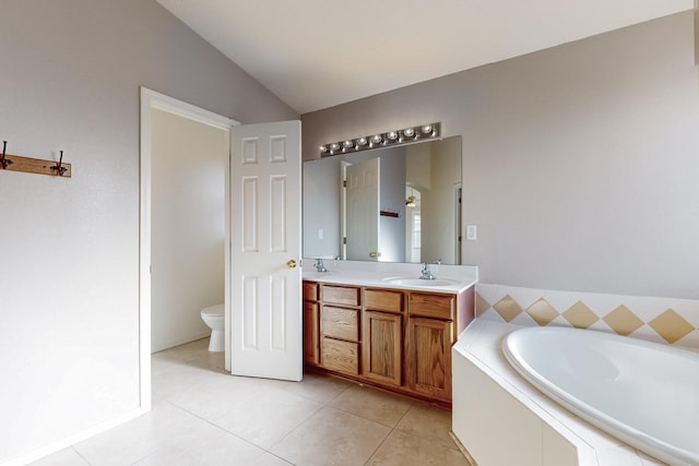 bathroom with tile patterned floors, vanity, tiled bath, toilet, and lofted ceiling