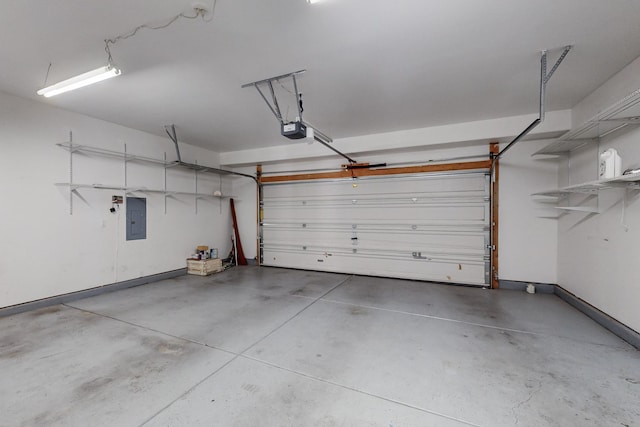 garage featuring electric panel and a garage door opener