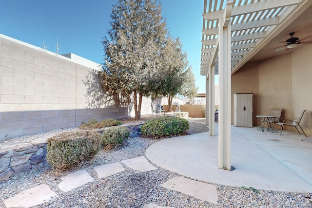 view of patio featuring ceiling fan and a pergola