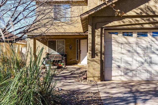 view of exterior entry featuring a garage