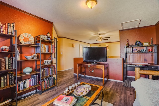 living room with crown molding, dark hardwood / wood-style flooring, ceiling fan, and a textured ceiling