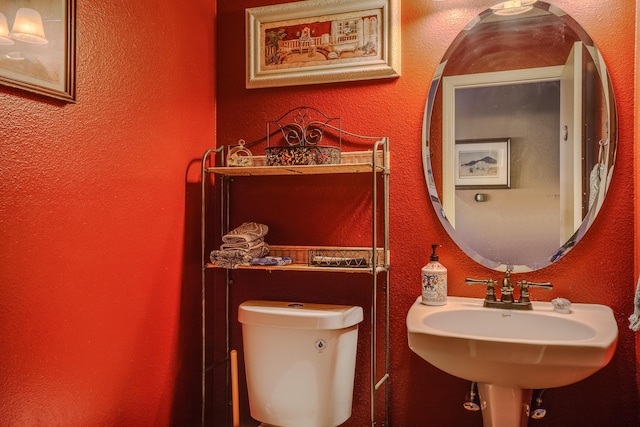 bathroom with toilet and sink