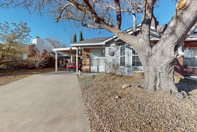 view of front of home with a carport