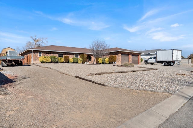 single story home with a garage