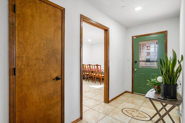 entryway with light tile patterned floors