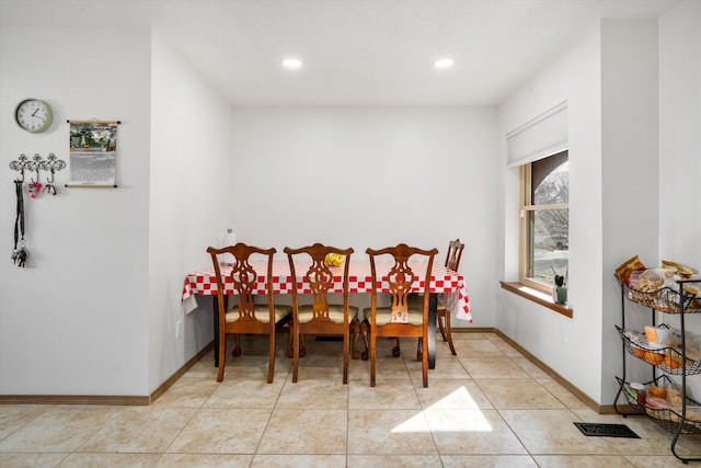 dining area featuring light tile patterned floors