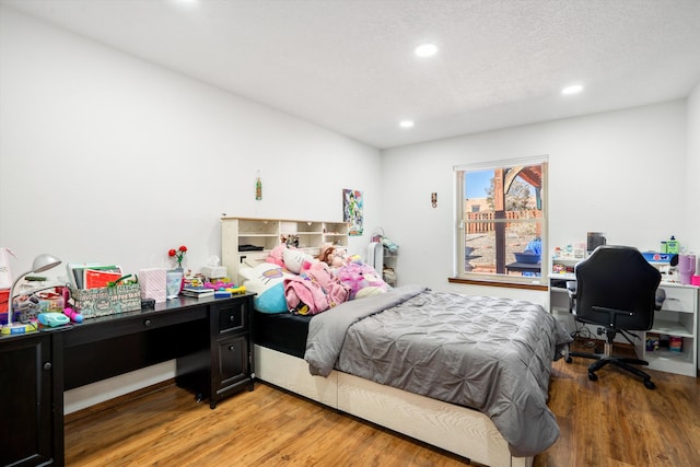 bedroom with light hardwood / wood-style floors