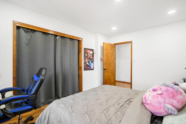 bedroom featuring a closet and hardwood / wood-style flooring