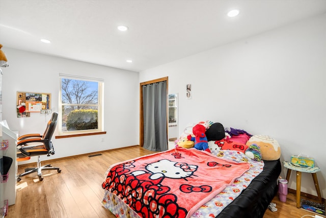 bedroom featuring hardwood / wood-style flooring