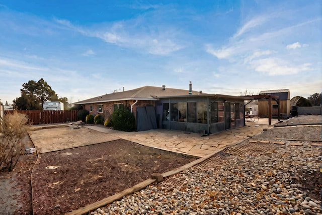 rear view of property with a patio area and a pergola