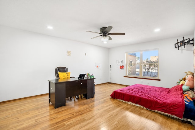 bedroom with ceiling fan and light hardwood / wood-style flooring