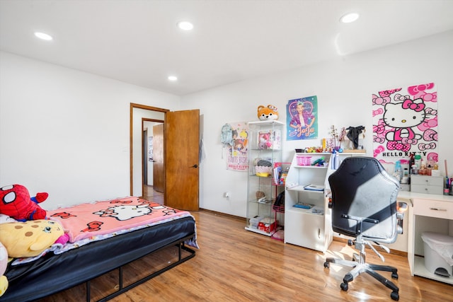 bedroom featuring wood-type flooring