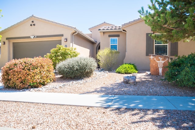 6340 Camino De Paz NW, Albuquerque, NM 87120 - mediterranean / spanish home featuring a garage