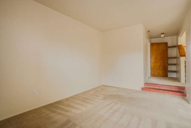 empty room featuring carpet floors