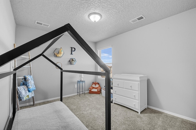 bedroom featuring visible vents, baseboards, and carpet