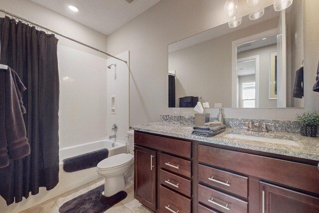 full bathroom with vanity, tile patterned floors, toilet, and shower / bath combo