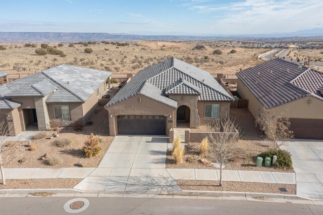 view of front of house featuring a garage and a mountain view